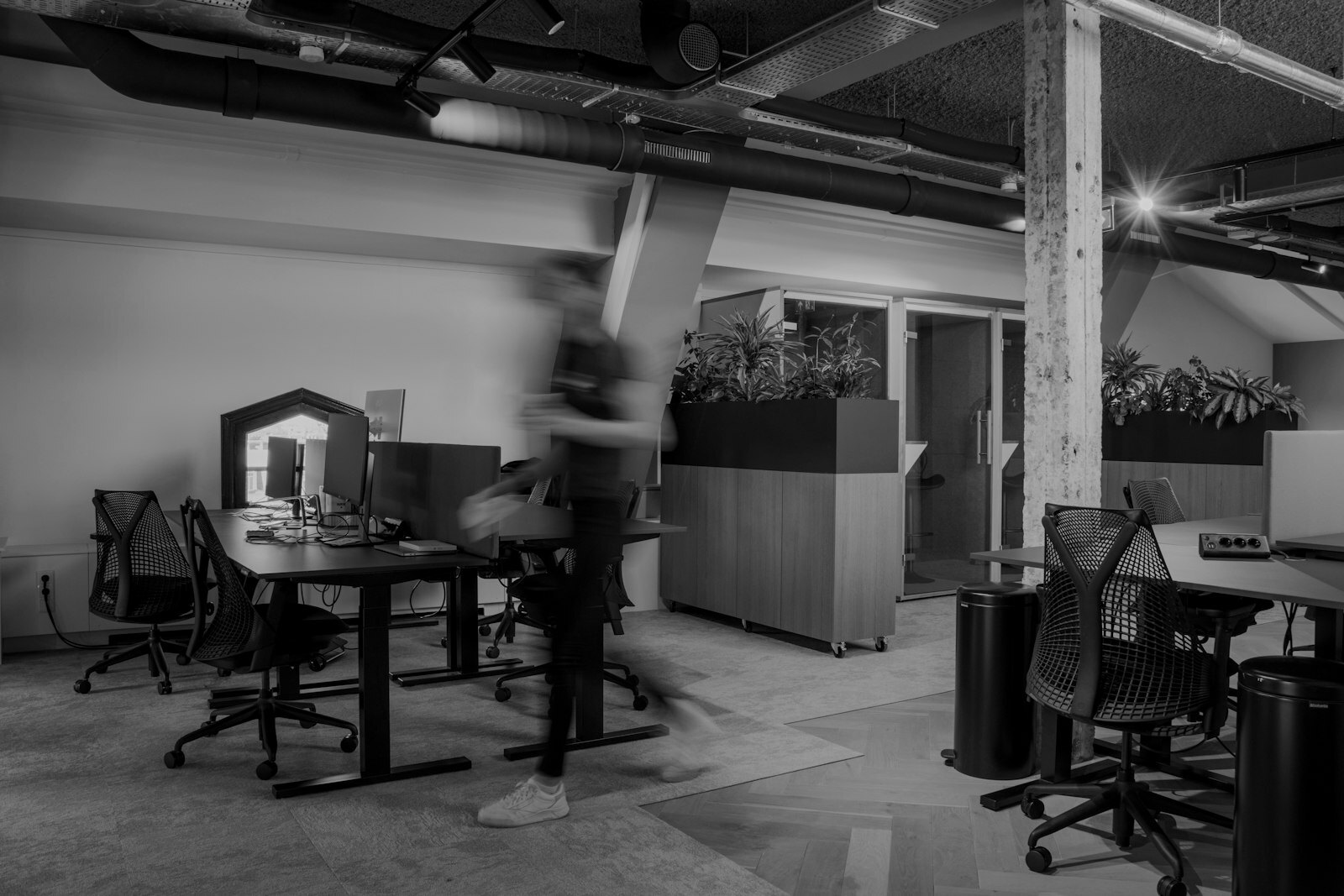 a blurry photo of a man in an office