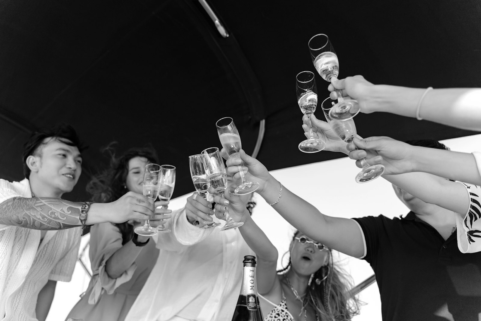 a group of people holding up wine glasses